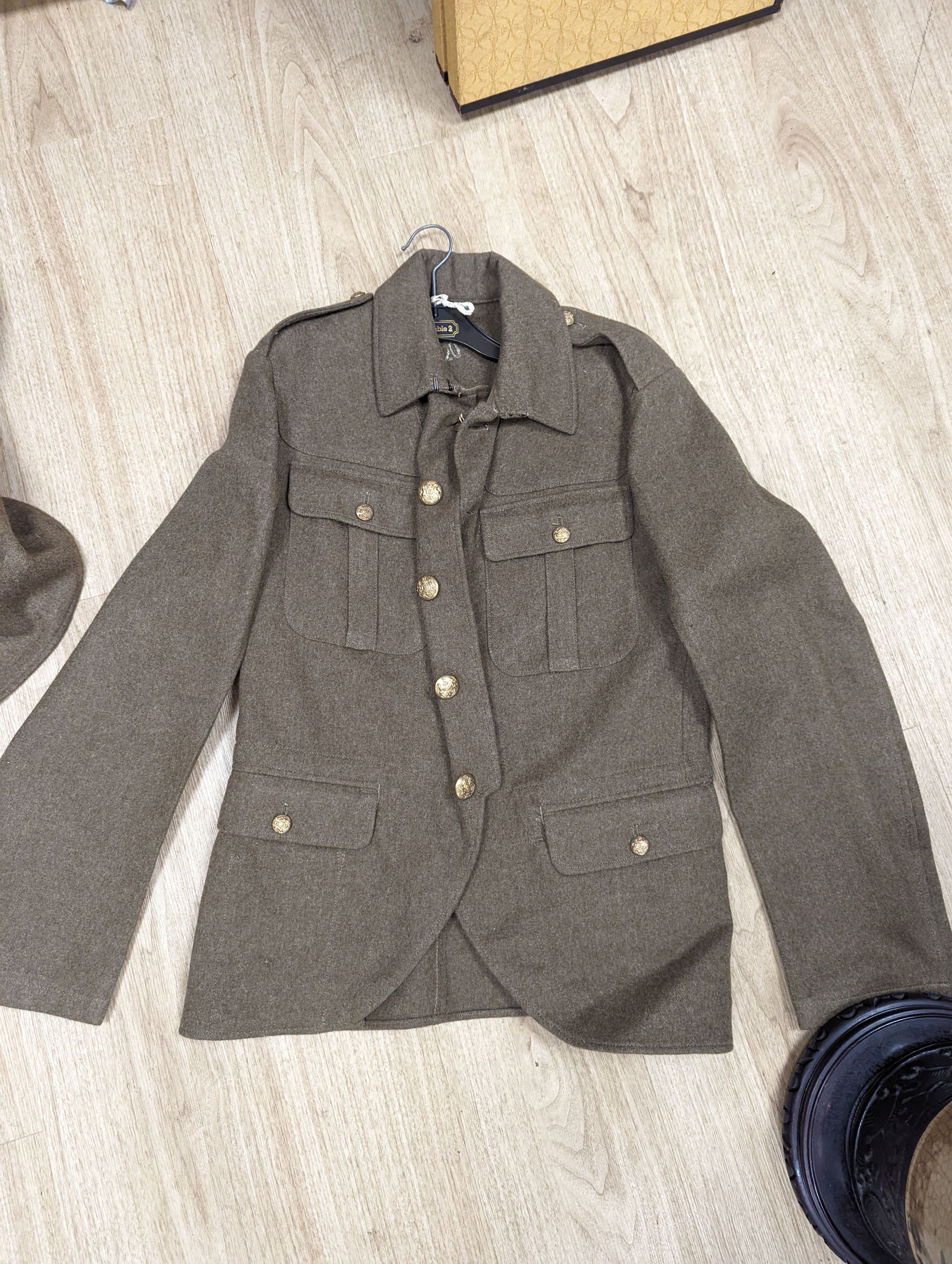 Two German WWI jackets and a similar British jacket.